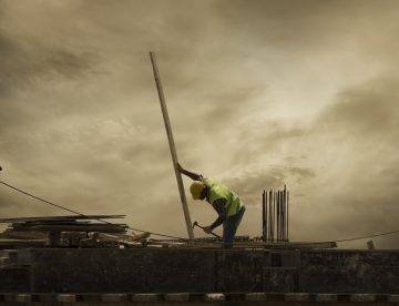 construction worker working alone on a roof