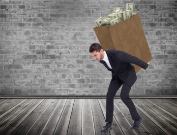 Image of a man with a sack of money on his back, representing the idea of overspending.