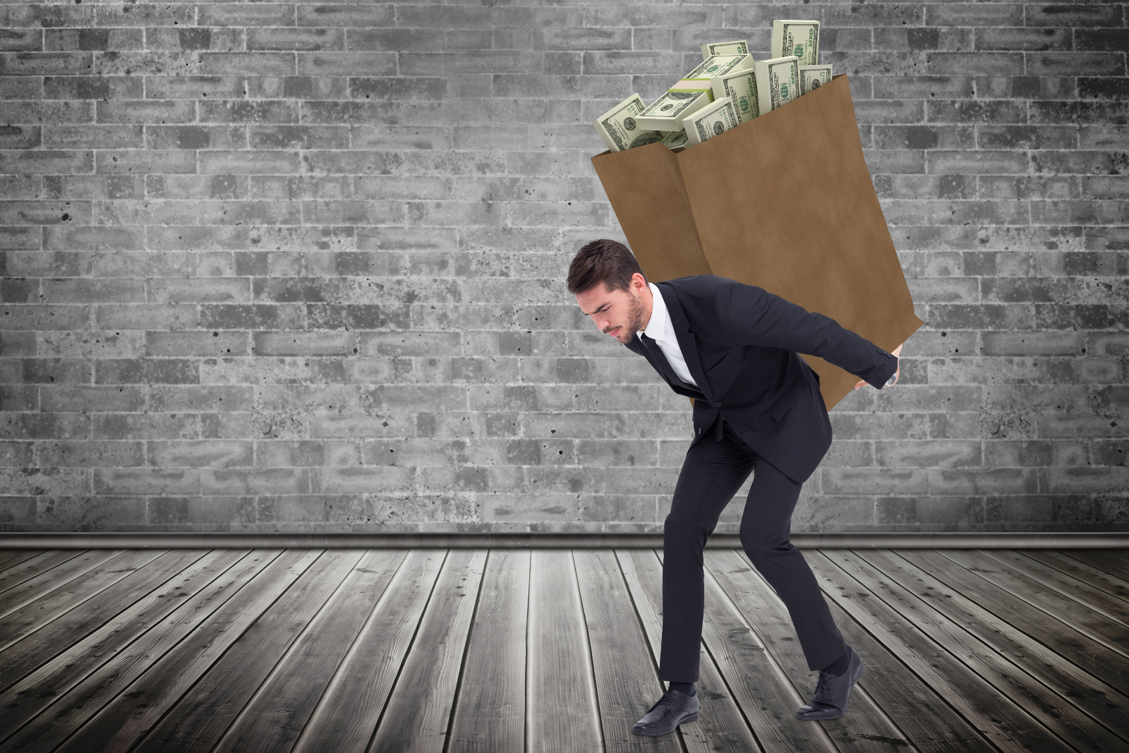 Image of a man with a sack of money on his back, representing the idea of overspending.