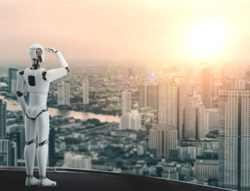 Image of a robot (humanoid-style) looking over a cityscape