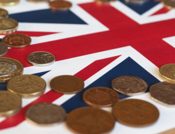 Image showing various British coins sitting on a Union Jack background