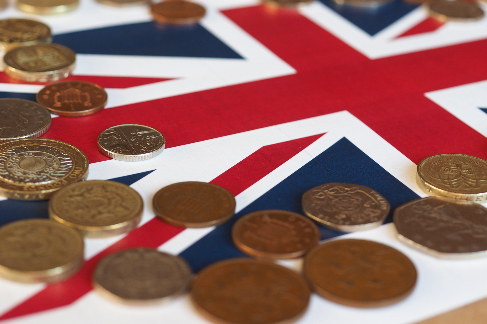 Image showing various British coins sitting on a Union Jack background