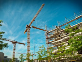 Image of a construction site with lots of cranes