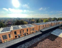 Image of several buildings showing the roofing with solar panels