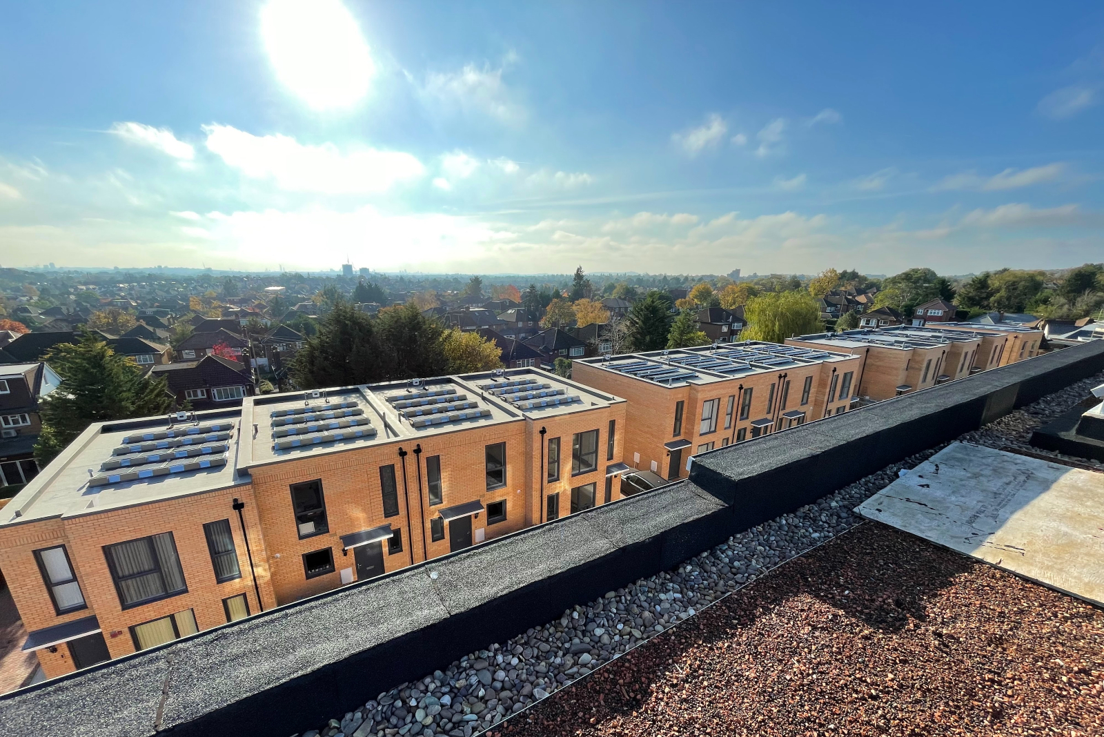 Image of several buildings showing the roofing with solar panels
