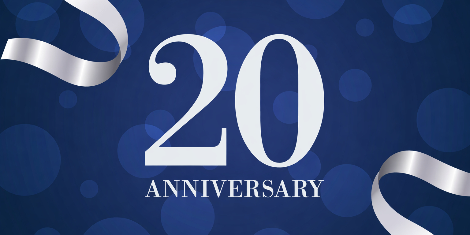 Words 20 Anniversary in silver on a blue background