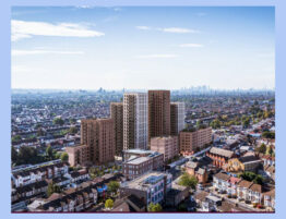 Development site featuring several blocks of apartments with the London skyline in the background